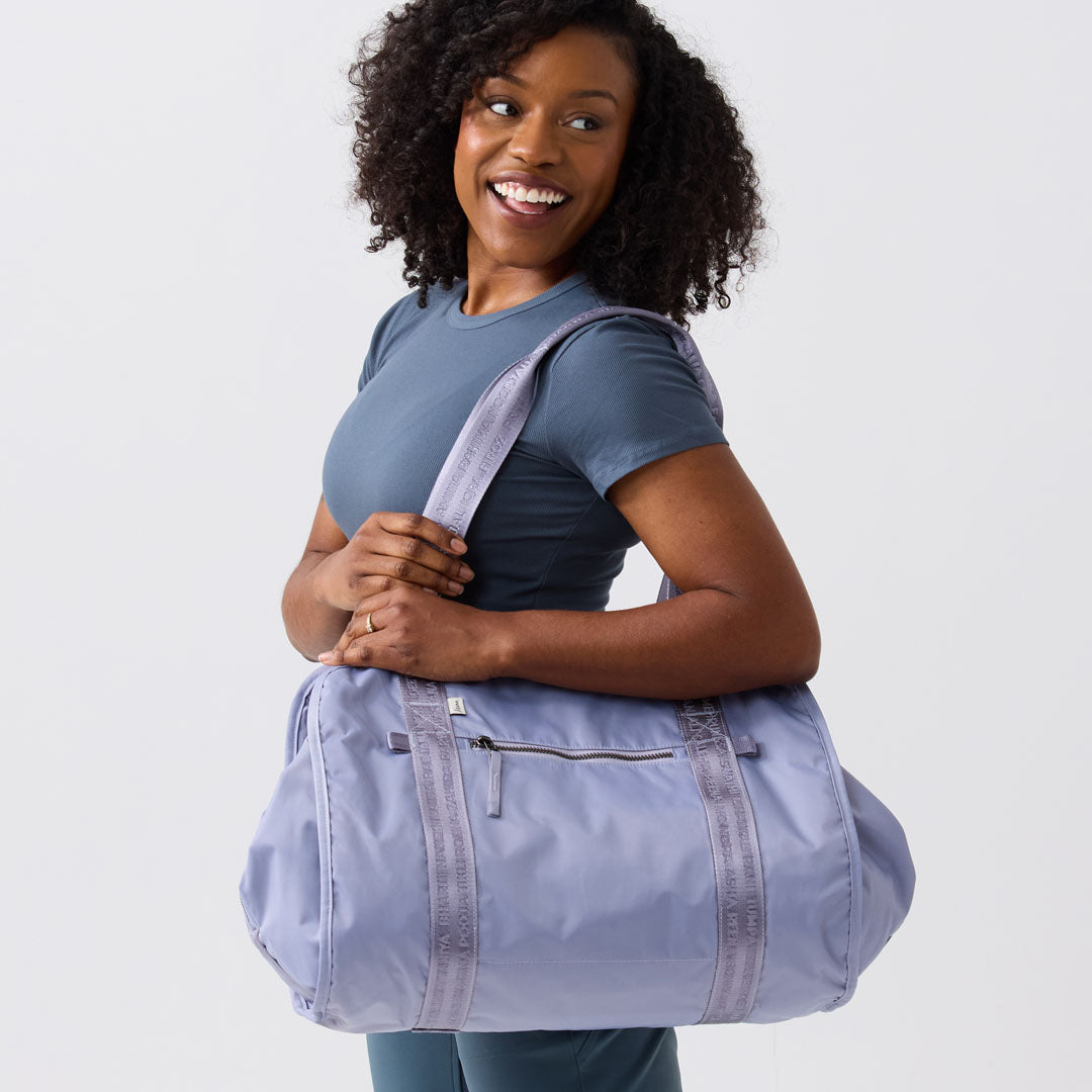 Stylish lilac yoga bag tote carried by woman heading to yoga class #lilac