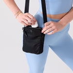 Small shoulder bag for women featuring interior zip pockets and snap slips #black