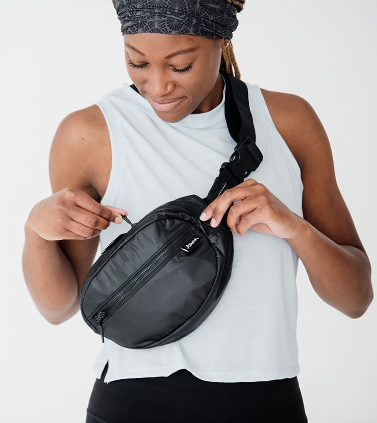 model size 4 wearing black regular belt bag crossbody