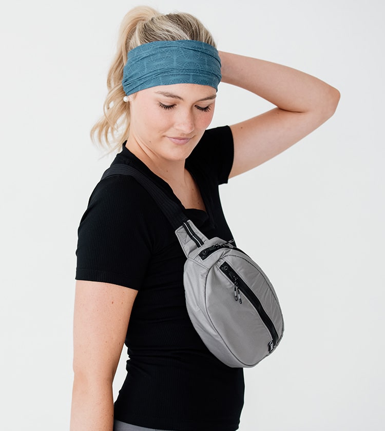 model size 4 wearing gray regular belt bag crossbody