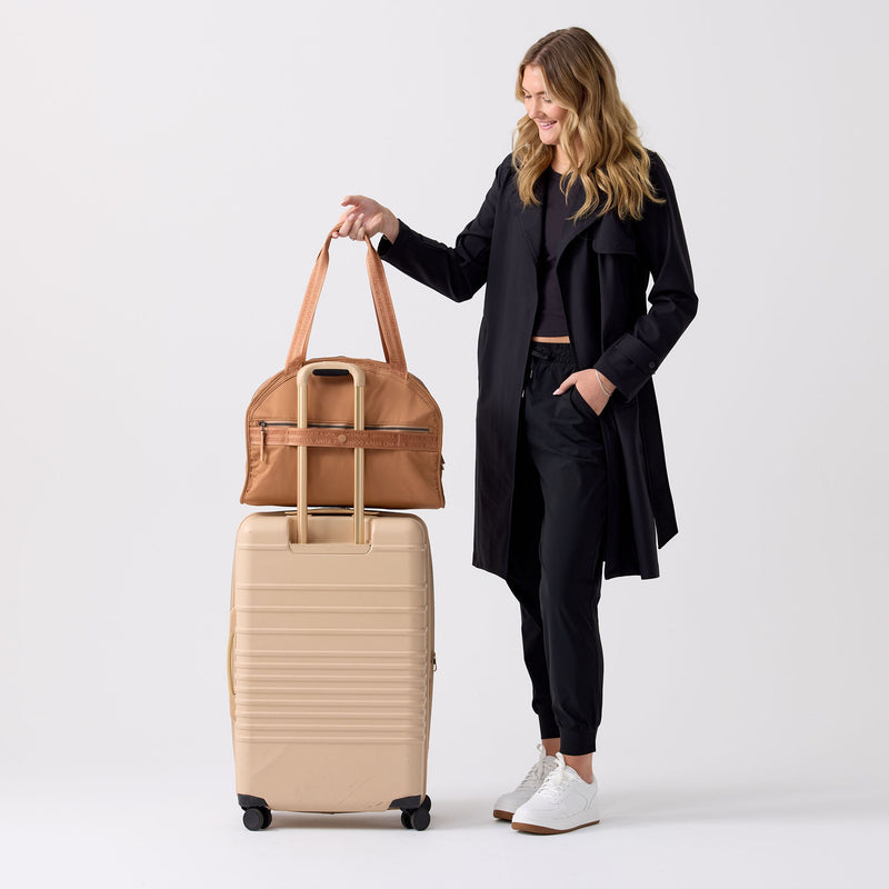 Slides onto your carry-on, drops the second bag