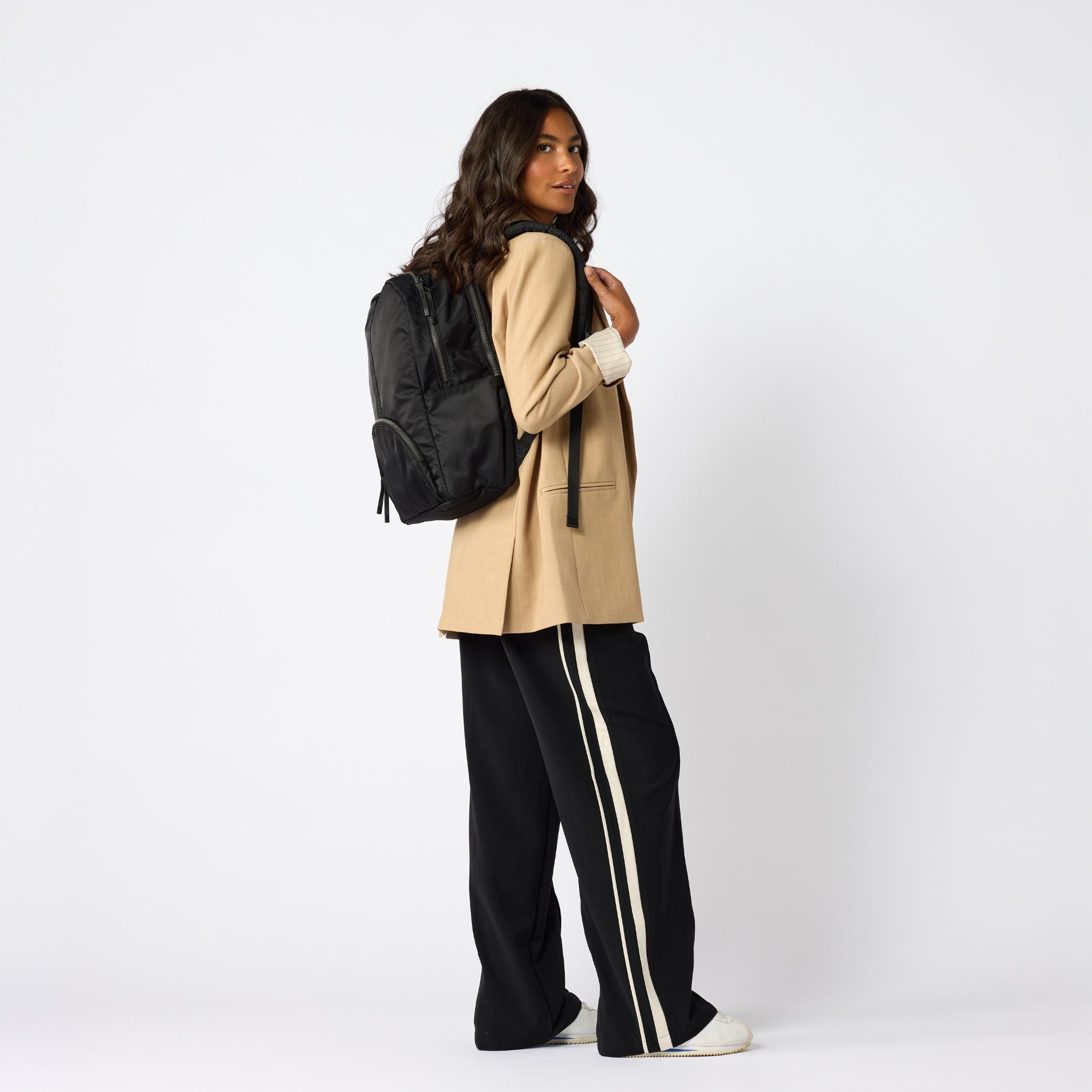 Black foldable carry-on daypack angled front view. #black