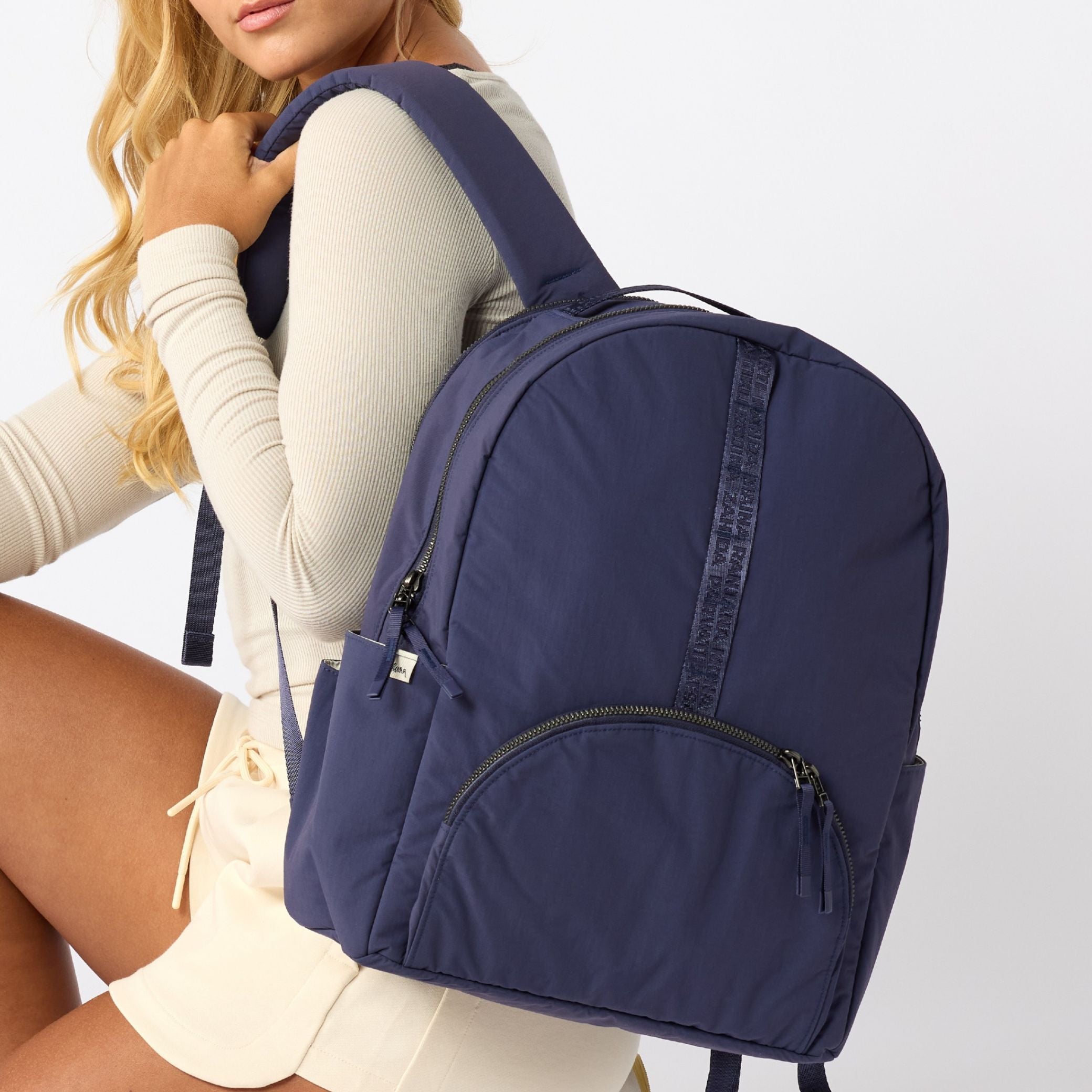 Indigo travel backpack back view with padded straps. #indigo