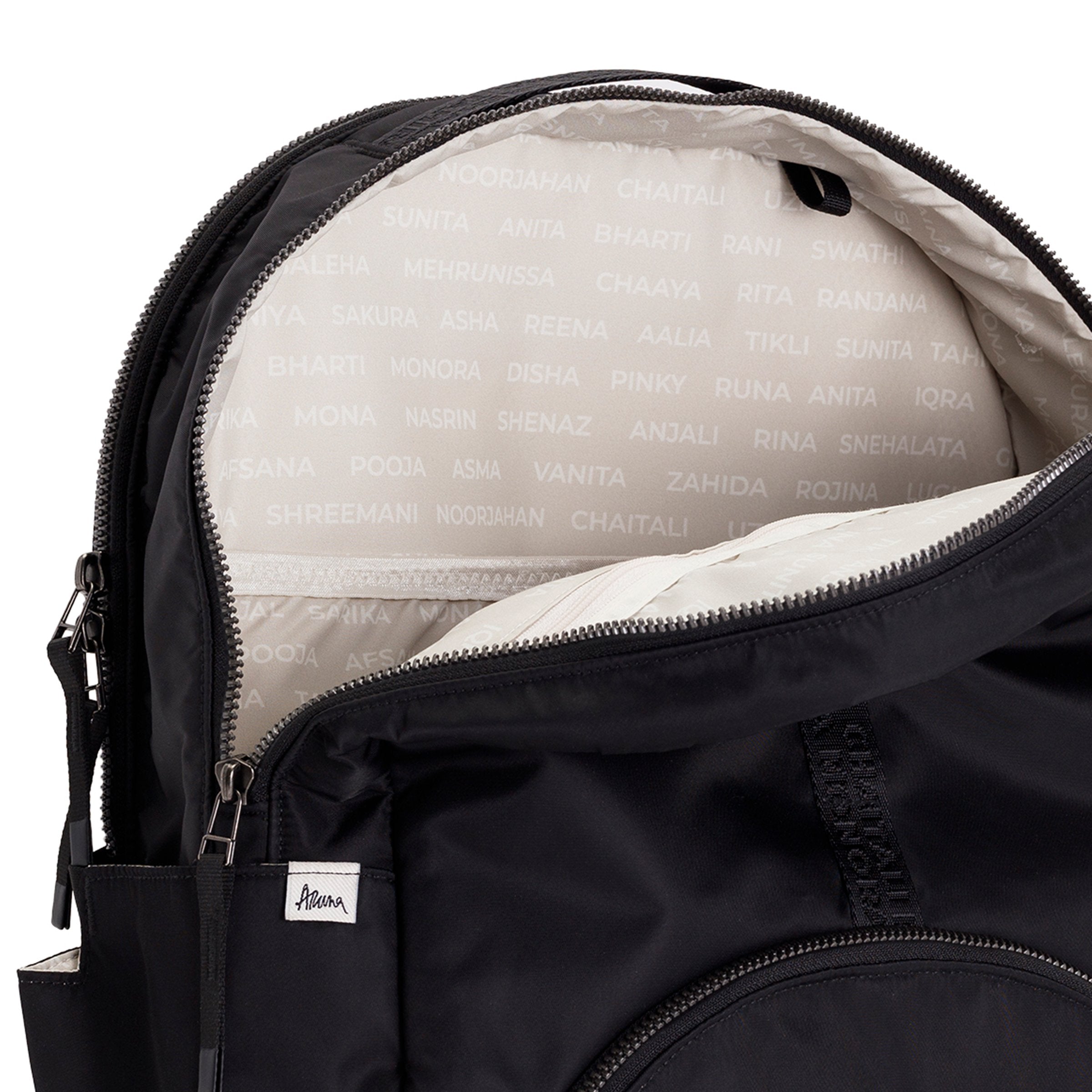 Black Geeta nylon backpack open at the top, revealing the gray and white printed-name lining inside the main compartment. #black