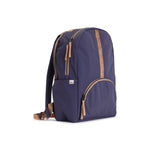 Indigo and Camel Geeta nylon backpack, side profile showing the slim depth, side pocket and camel shoulder straps. #indigo_and_camel