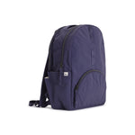 Indigo Geeta nylon backpack, side profile showing the slim depth, side pocket and padded shoulder straps. #indigo