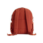 Rust Red Geeta nylon backpack, back view showing the padded back panel and adjustable shoulder straps. #rust_red