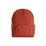 Rust Red Geeta nylon backpack, front view showing the rounded zip front pocket and top grab handle. #rust_red