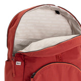 Rust Red Geeta nylon backpack open at the top, revealing the gray and white printed-name lining inside the main compartment. #rust_red