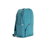 Solid Teal Geeta nylon backpack, side profile showing the slim depth, side pocket and padded shoulder straps. #solid_teal