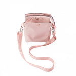 Pink crossbody bag with a strap on a white background #blush
