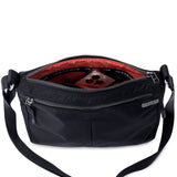 Shree Crossbody in black — interior view with two zip pockets #black